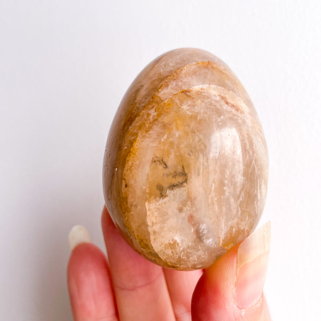 Golden healer quartz crystal polished egg with stand
