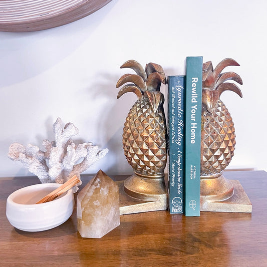 Golden pineapple bookend pair