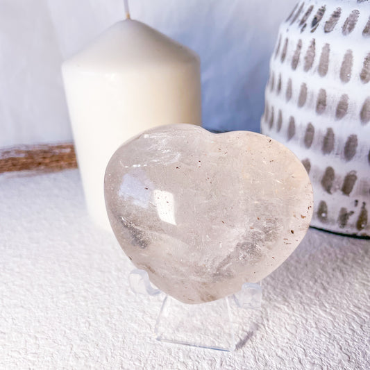 Clear quartz crystal heart with inclusions