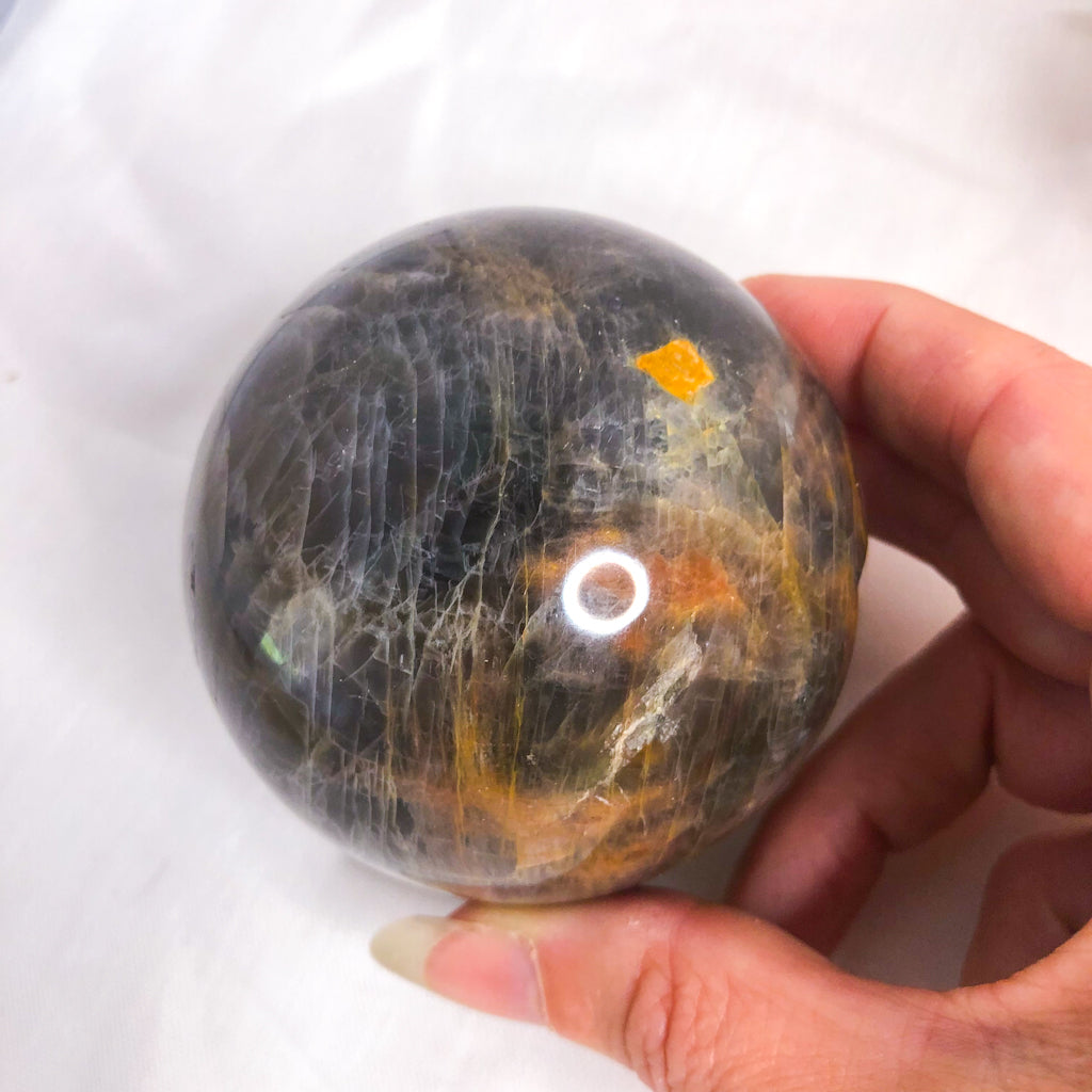Moonstone black crystal sphere + Hematite stand