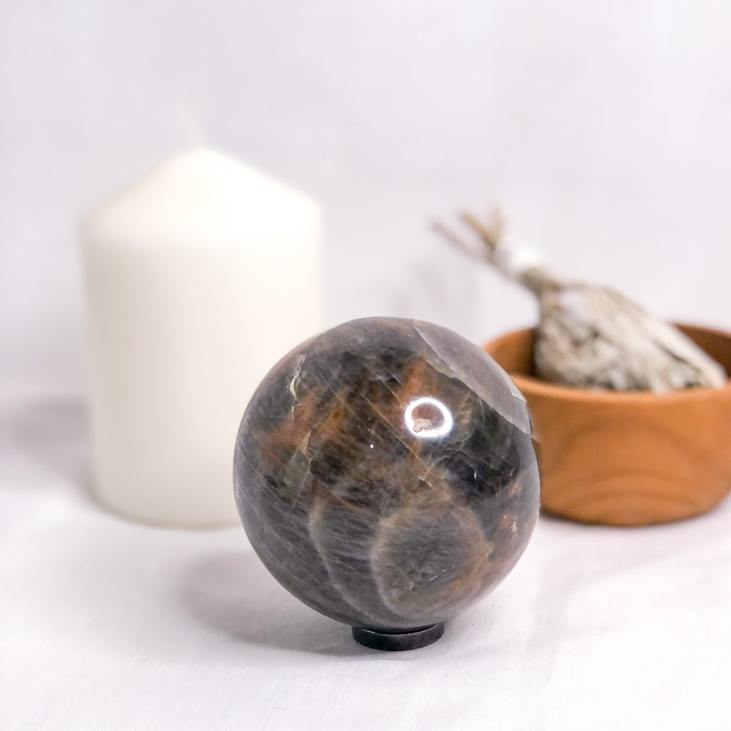 Moonstone black crystal sphere + Hematite stand