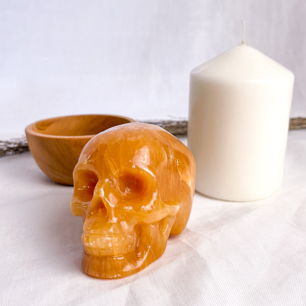 Calcite honey crystal skull carving