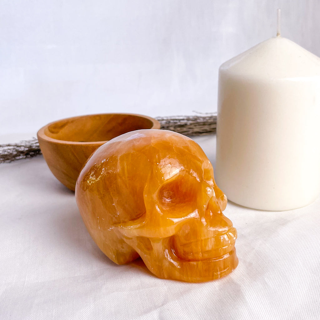 Calcite honey crystal skull carving