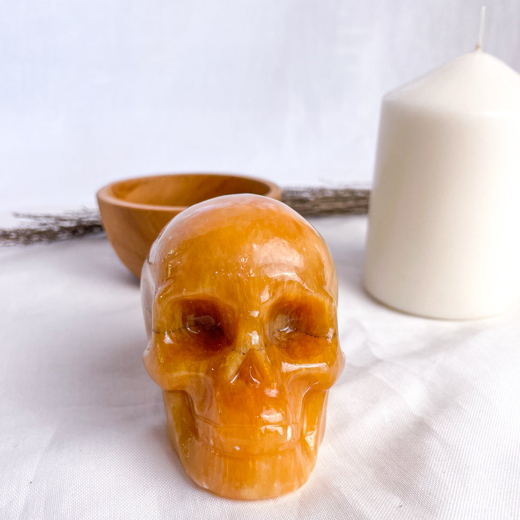 Calcite honey crystal skull carving
