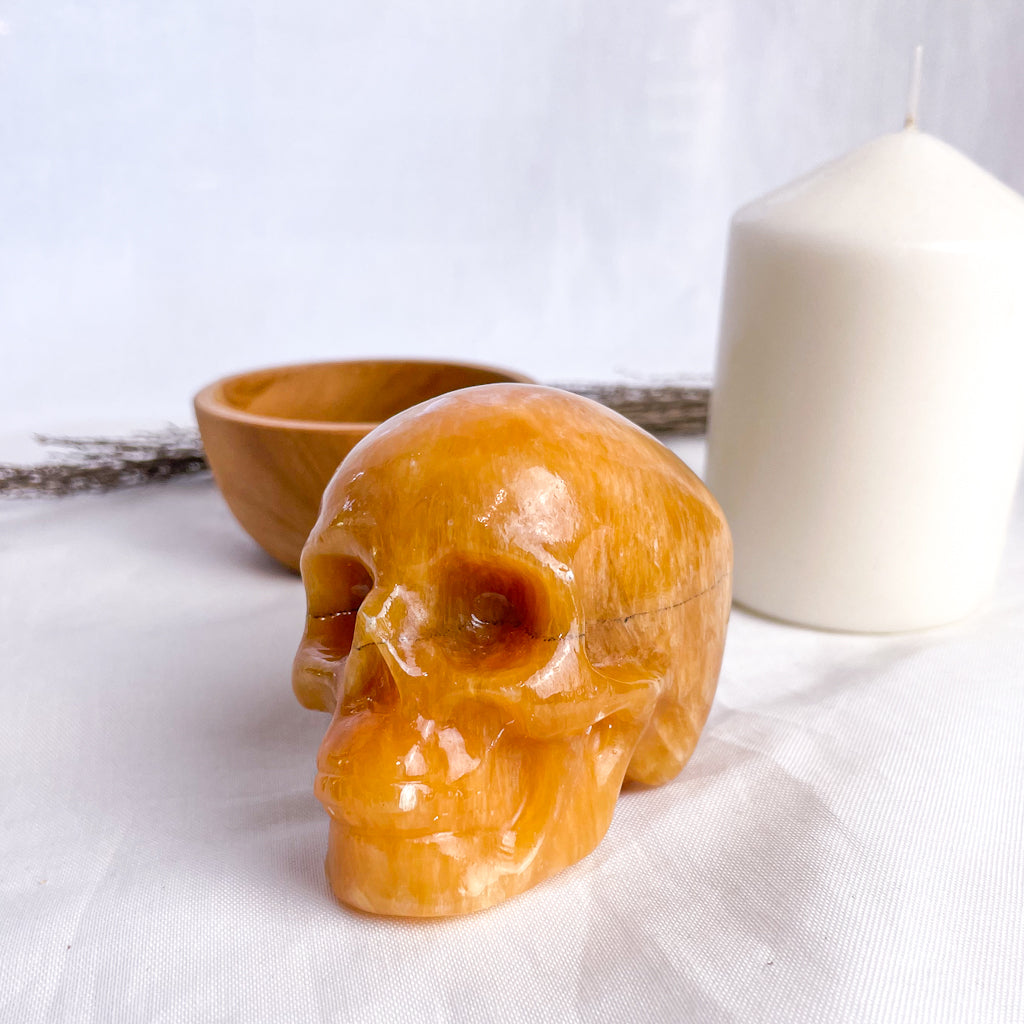 Calcite honey crystal skull carving