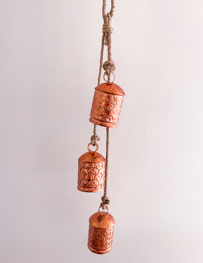 Ornate cow bells wind chime in rose gold copper