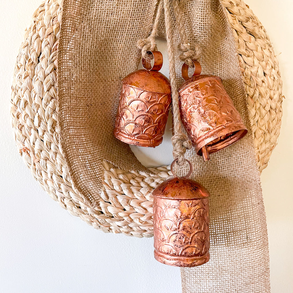 Ornate cow bells wind chime in rose gold copper