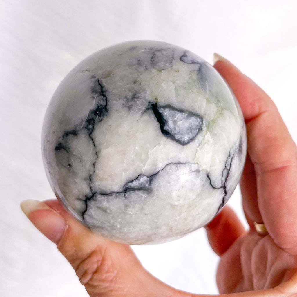 Serpentine white + black crystal sphere