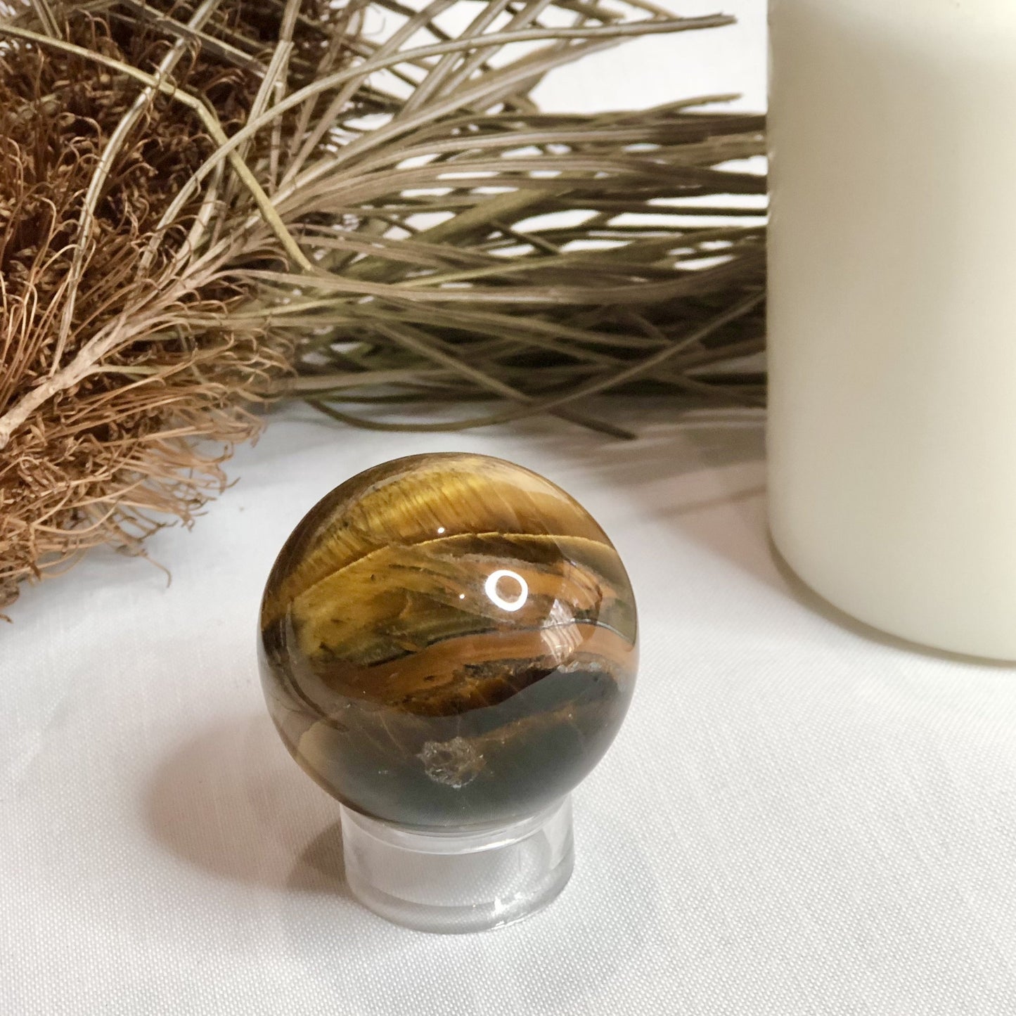 Tigers eye crystal palm stone sphere