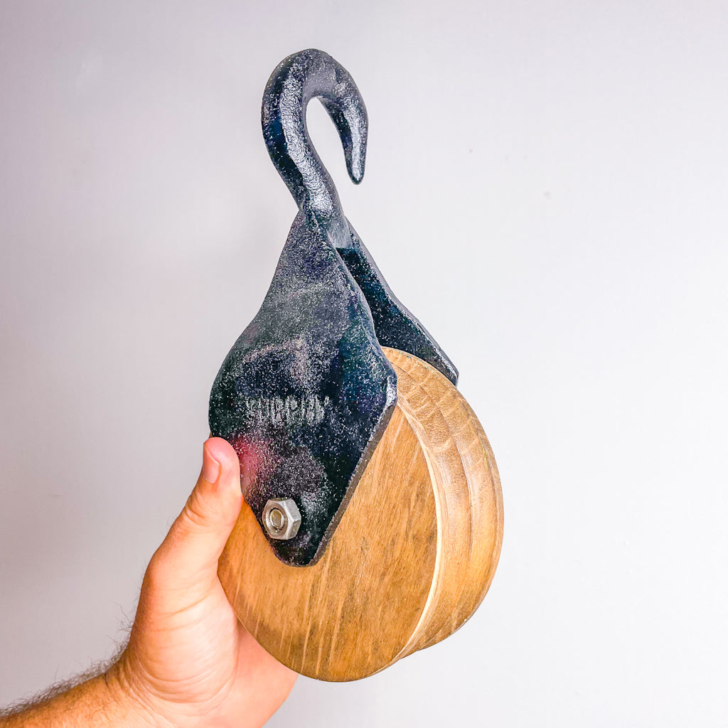 Antique wooden pulley wall decor