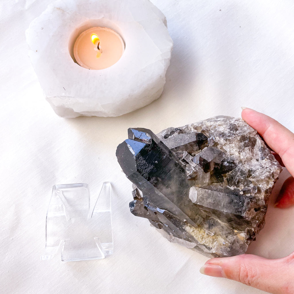Smoky quartz crystal cluster on stand