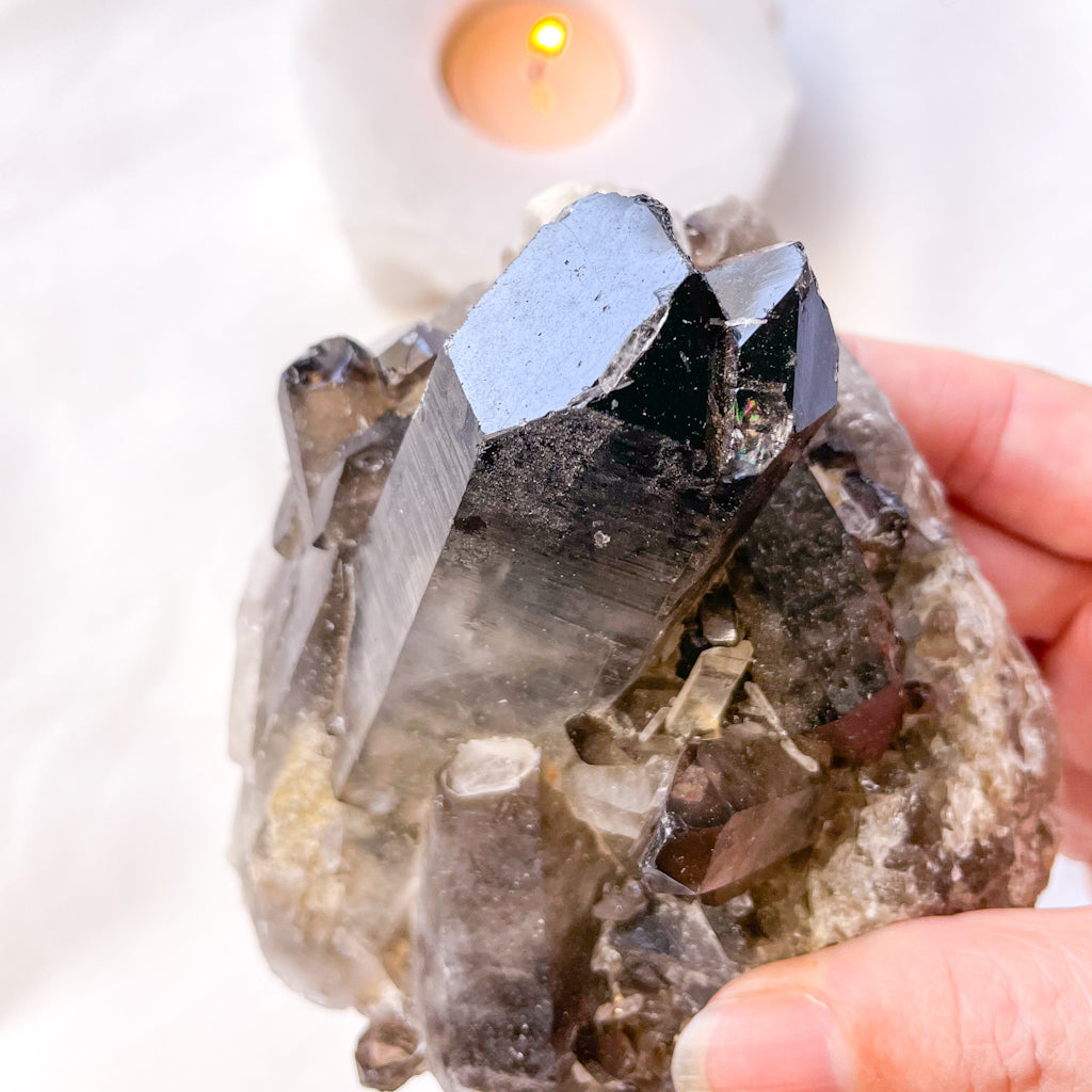 Smoky quartz crystal cluster on stand