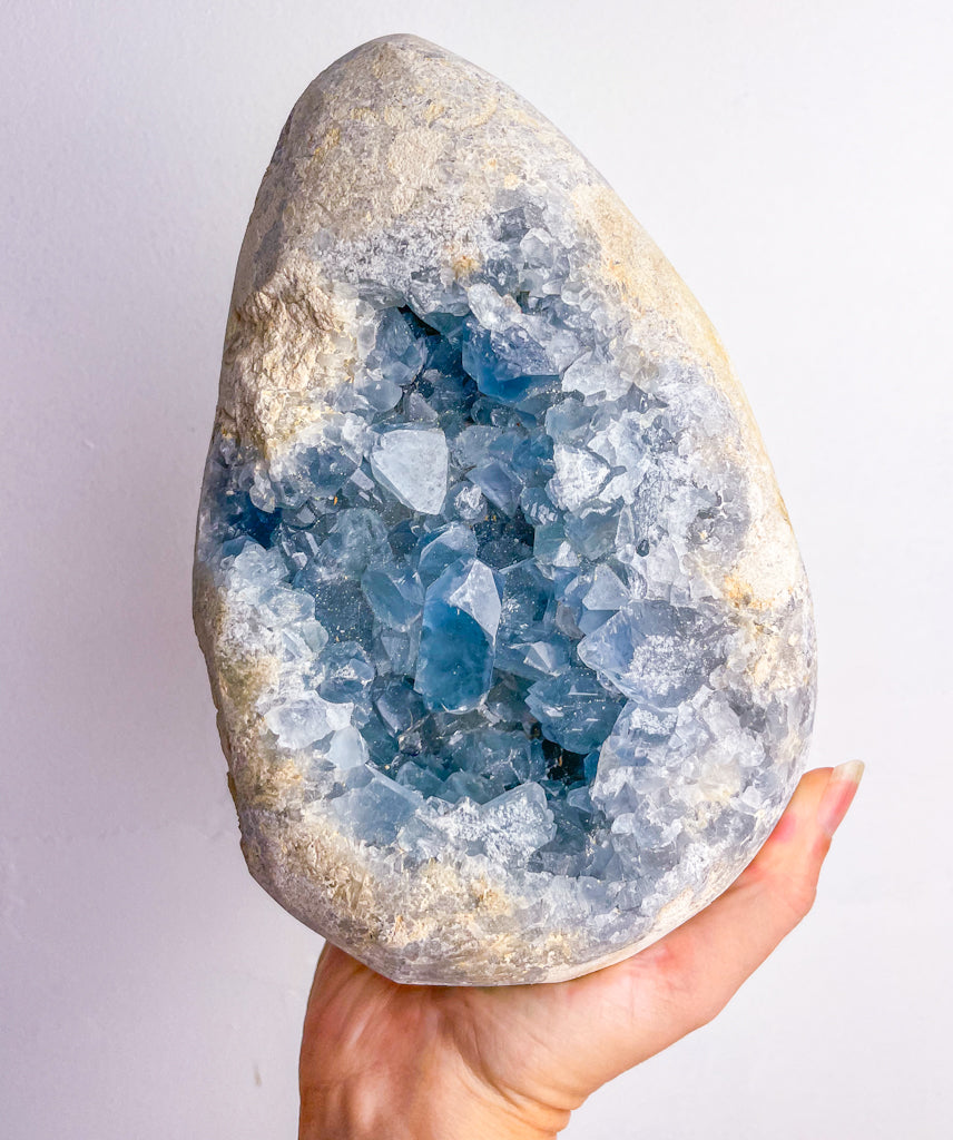 Celestite egg cluster geode crystal XXL 3.3kg on wooden stand