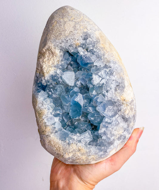 Celestite egg cluster geode crystal XXL 3.3kg on wooden stand