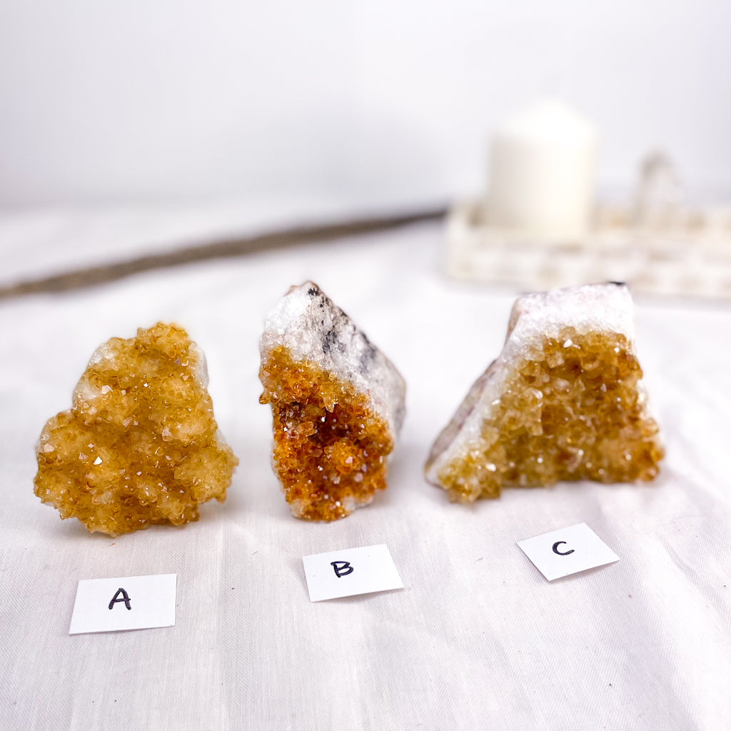 light honey coloured citrine crystal with even coloured cluster front