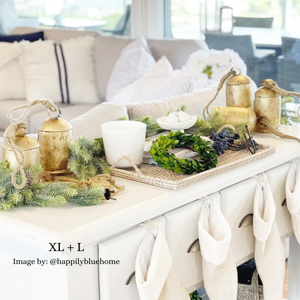 Extra large and Large brass gold cow bells in Christmas display