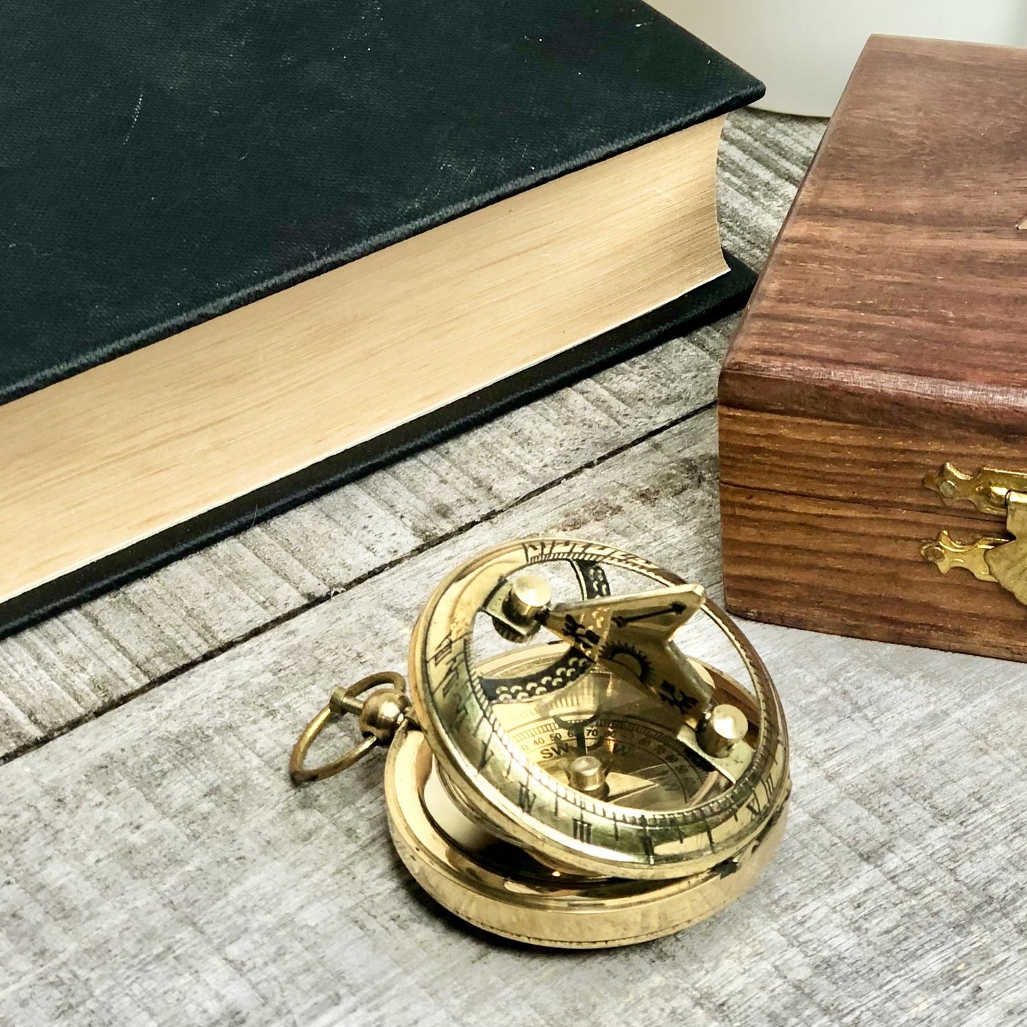 Antique brass compass, sundial and wooden box