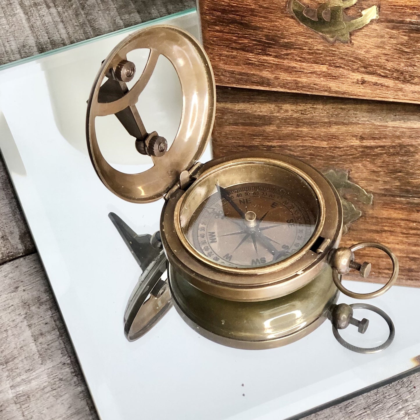 Antique brass compass, sundial and wooden box