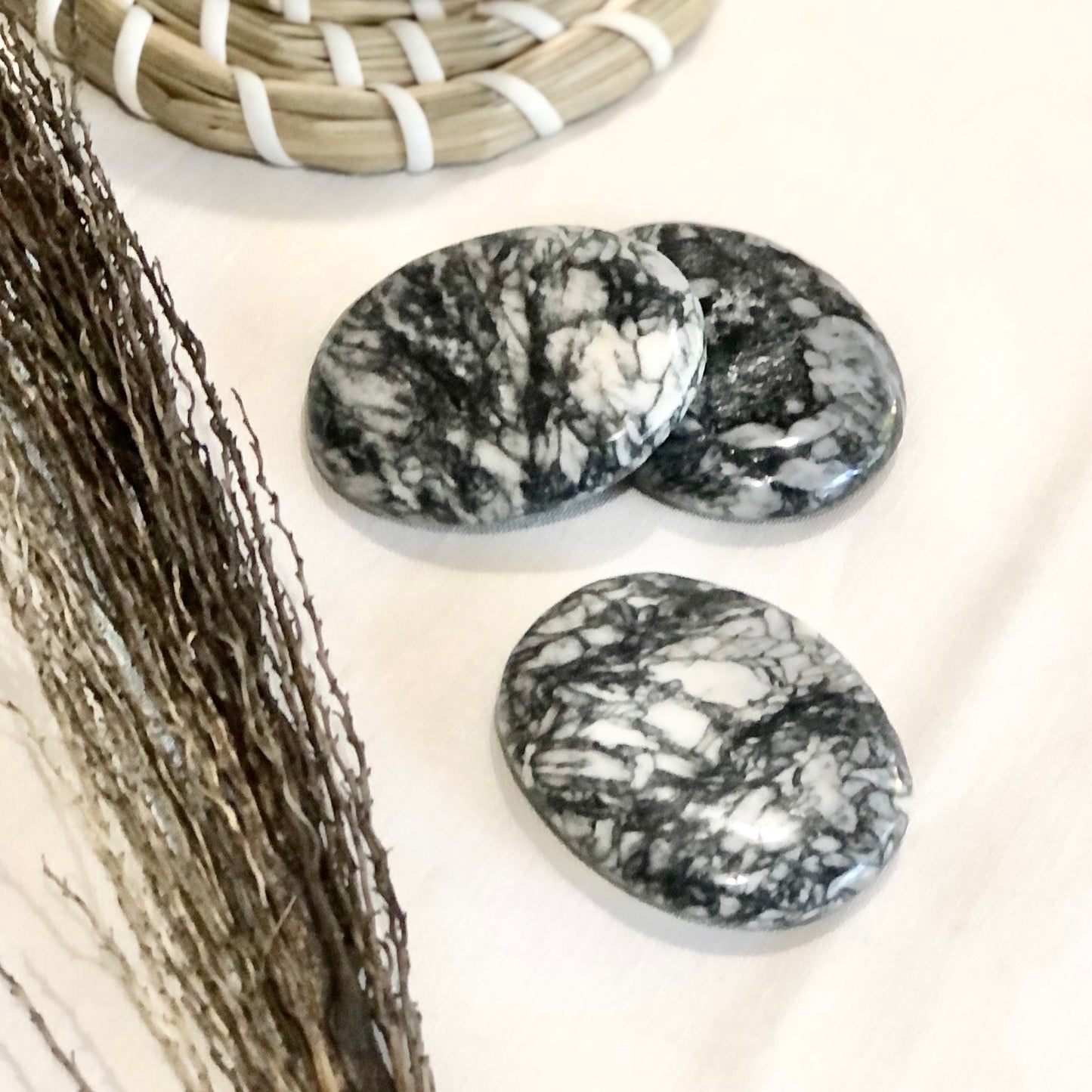 Pinolite crystal polished palm stone
