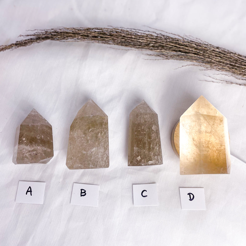 Smoky quartz crystal generator tower with inclusions