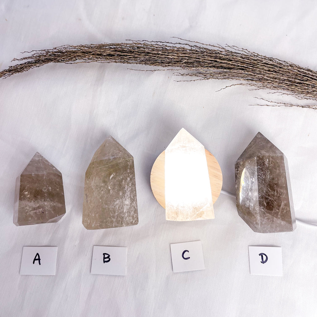 Smoky quartz crystal generator tower with inclusions