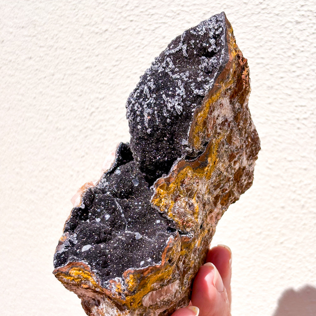 Manganese oxide, Rose quartz + Calcite crystal cluster on gold stand