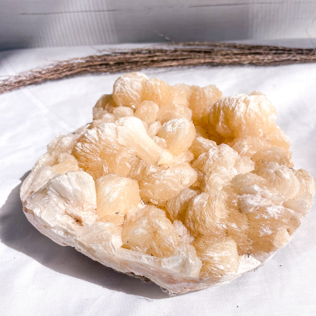 Peach stilbite crystal cluster