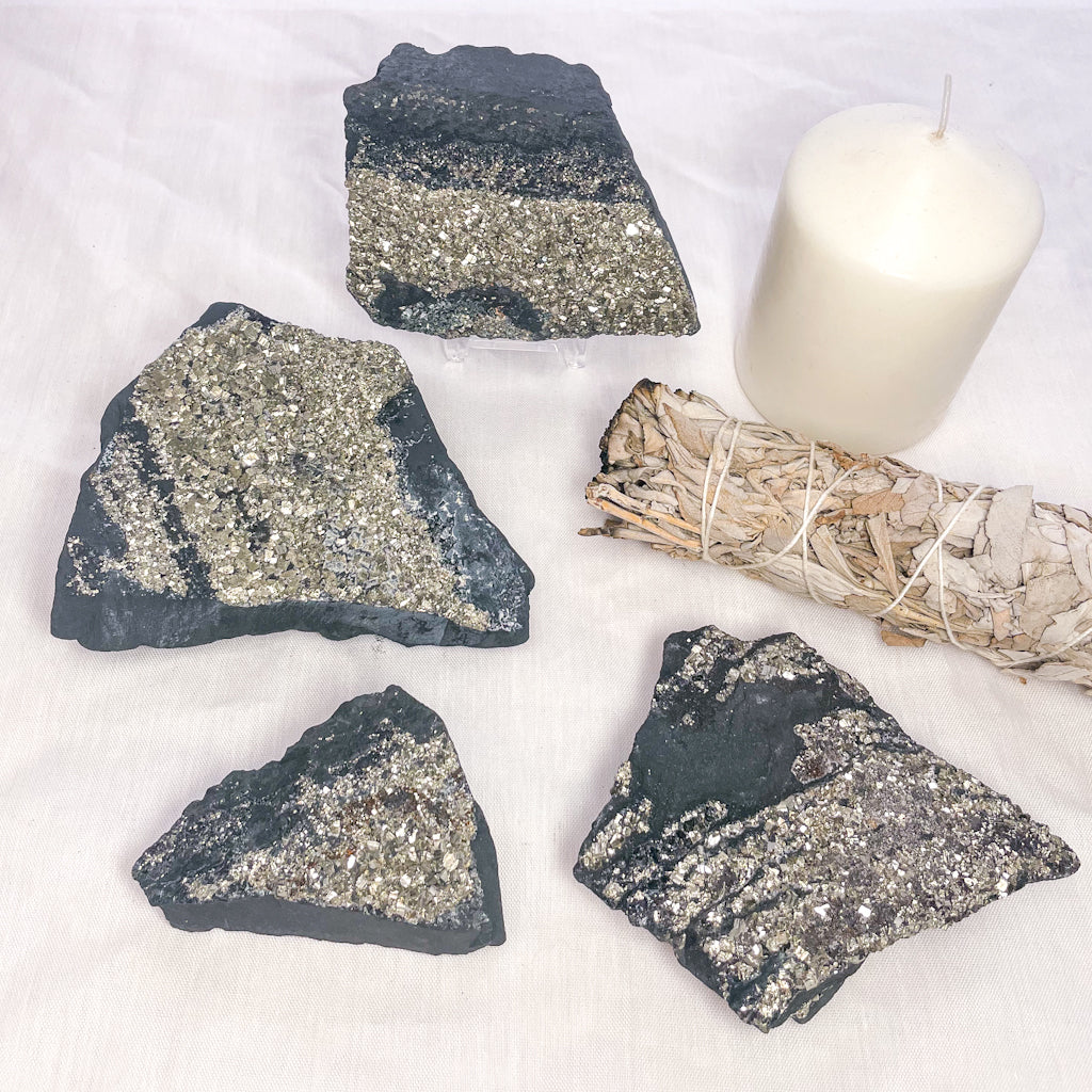 Pyrite cluster on Shungite crystal raw stone