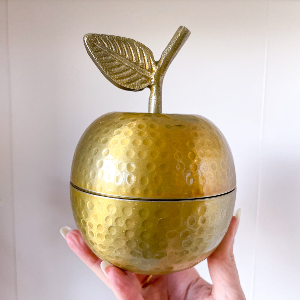 Golden apple jar with candle