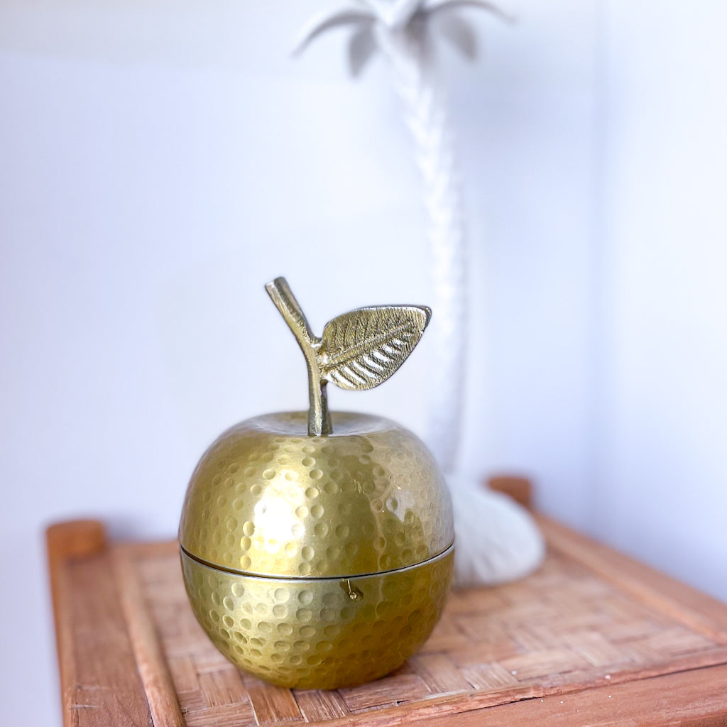 Golden apple jar with candle