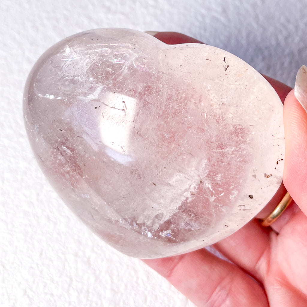 Clear quartz crystal heart with inclusions