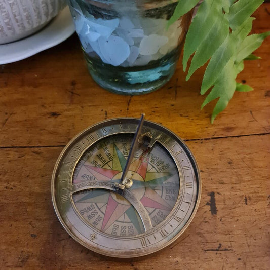 Antique bronze sundial and compass