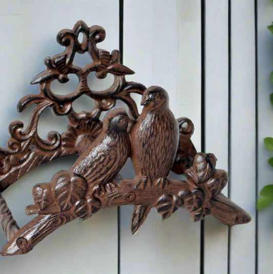 Vintage style bird ornate iron hose hanger