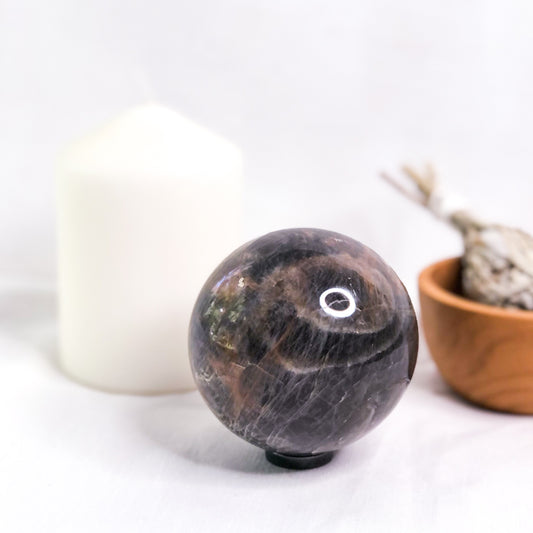Moonstone black crystal sphere + Hematite stand