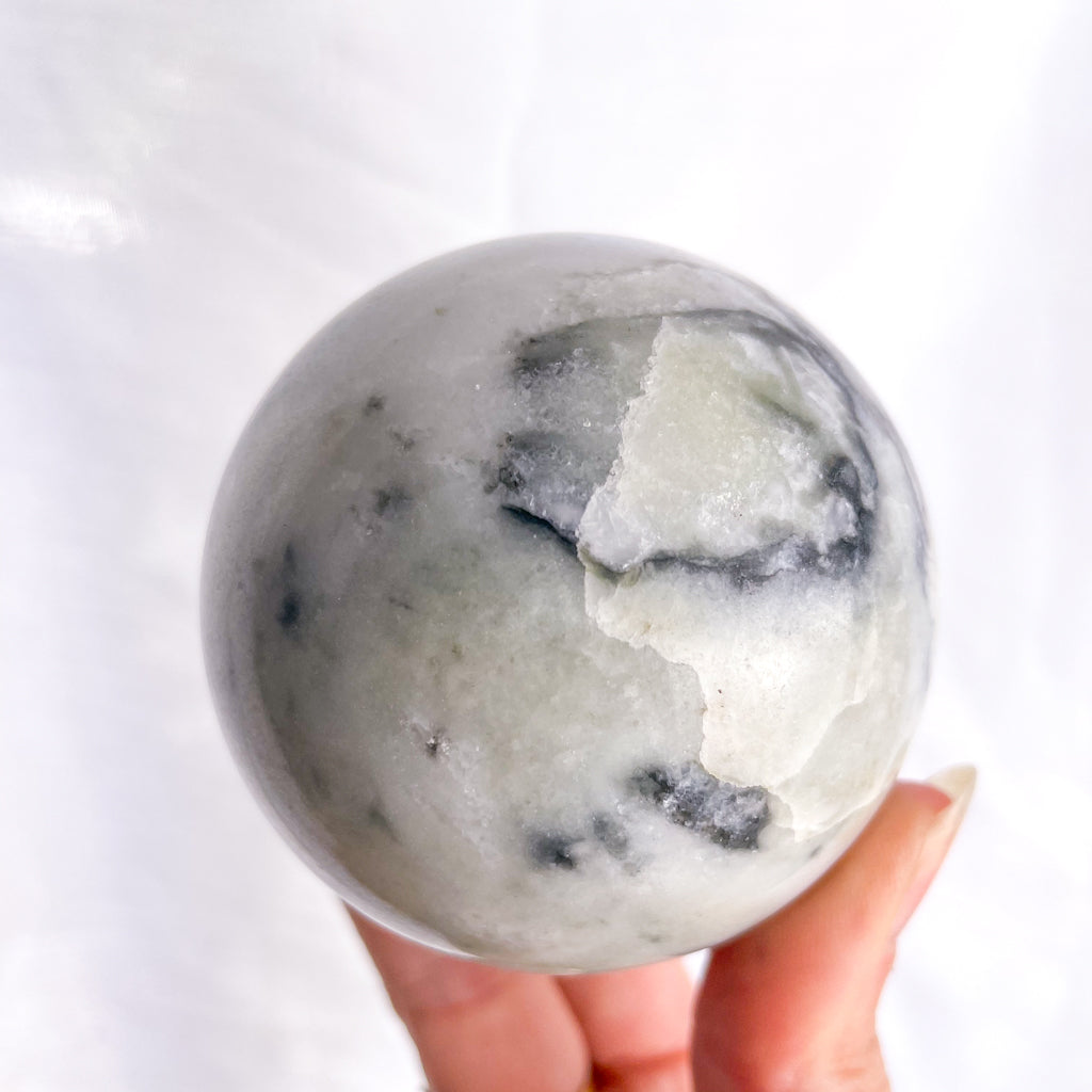 Serpentine white + black crystal sphere