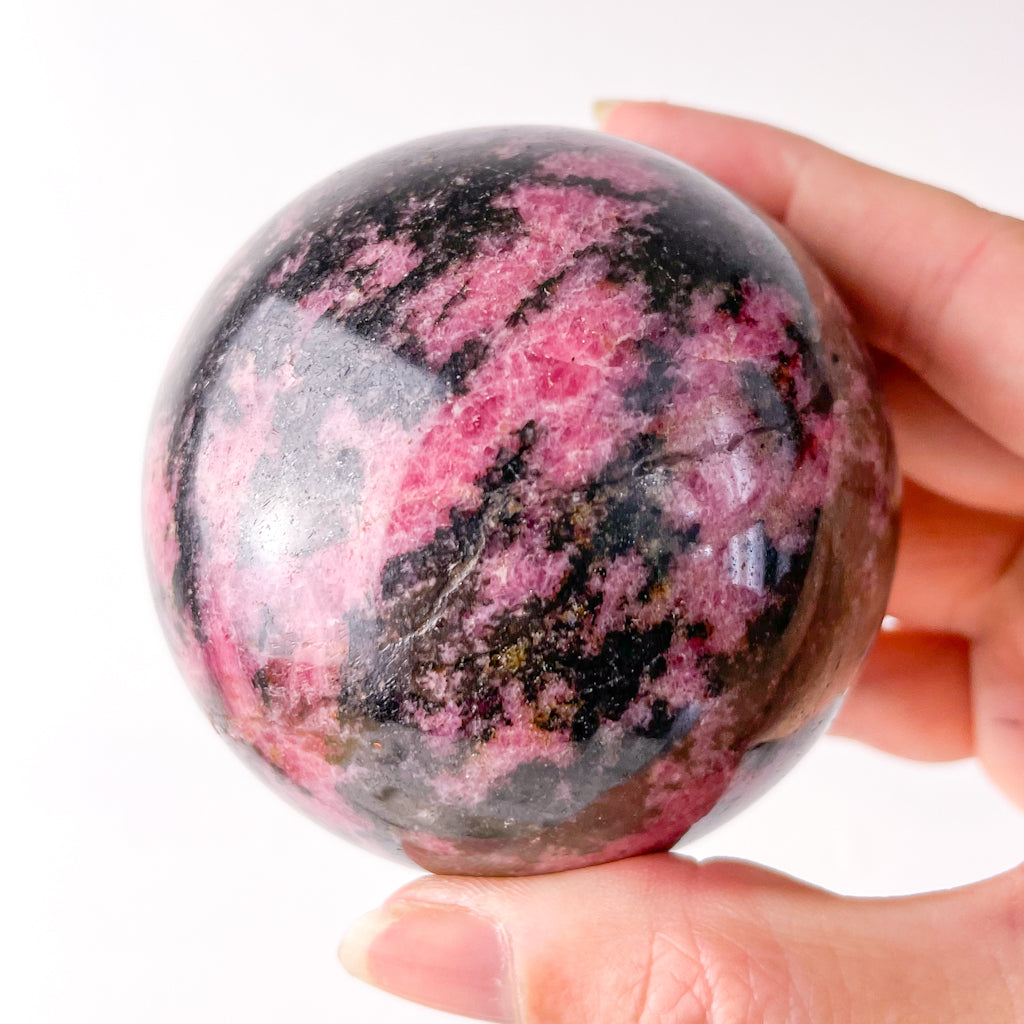 Rhodonite polished crystal sphere