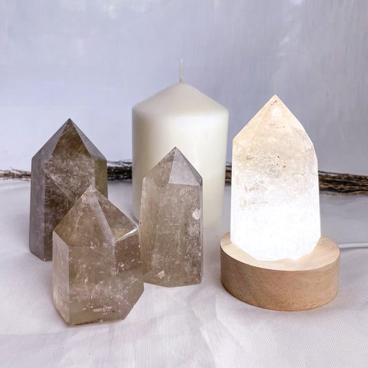 Smoky quartz crystal generator tower with inclusions